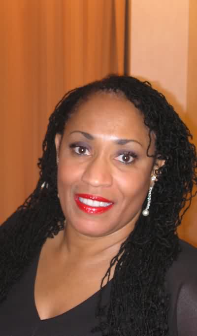 Tressie smiling in a portrait from her original website